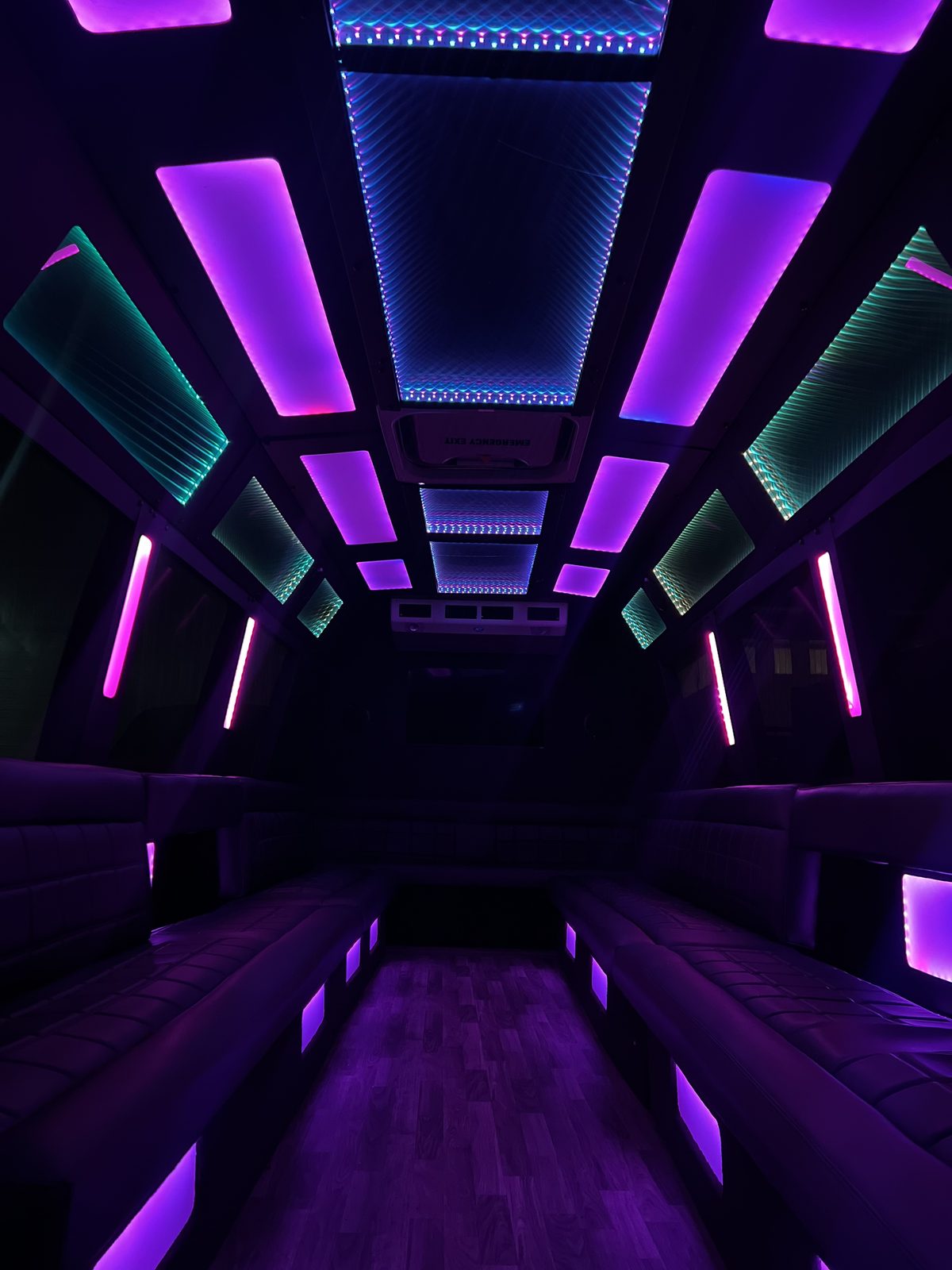 Limo mini bus interior with color LED ceiling and perimeter seating — Ballantyne Limousine, Charlotte NC