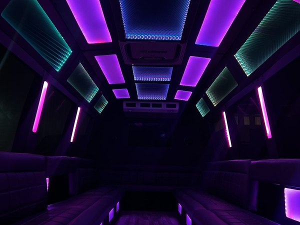 Limo mini bus interior with color LED ceiling and perimeter seating — Ballantyne Limousine, Charlotte NC